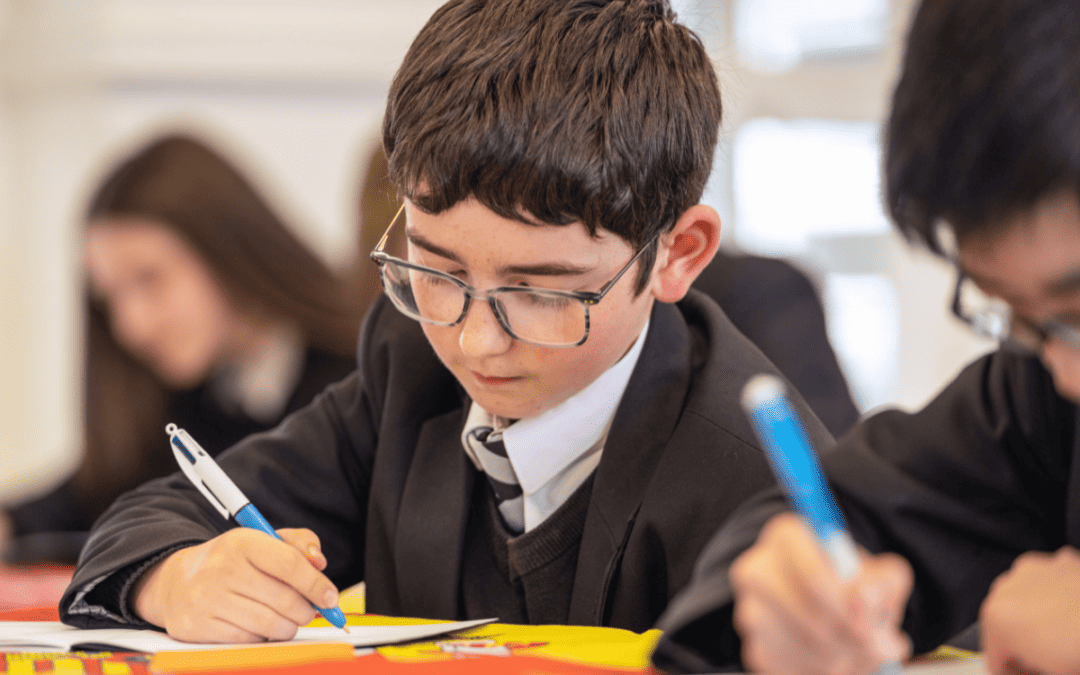 A student from Cheadle Hulme High School, the founding school of the Laurus Trust that has become a NCLE Language Hub, takes notes in a Spanish class