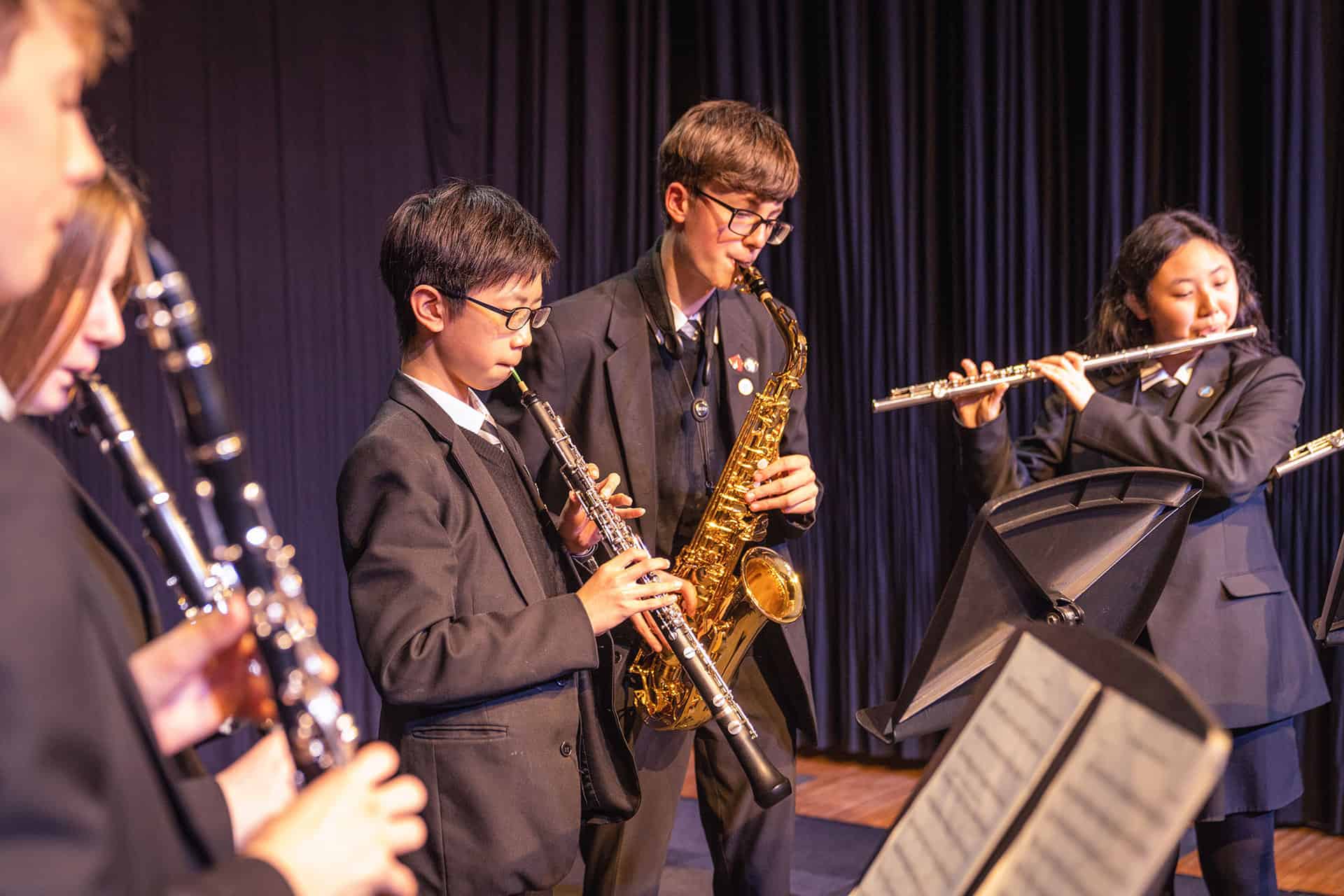 Image of students at a Laurus Trust school playing musical instruments. 