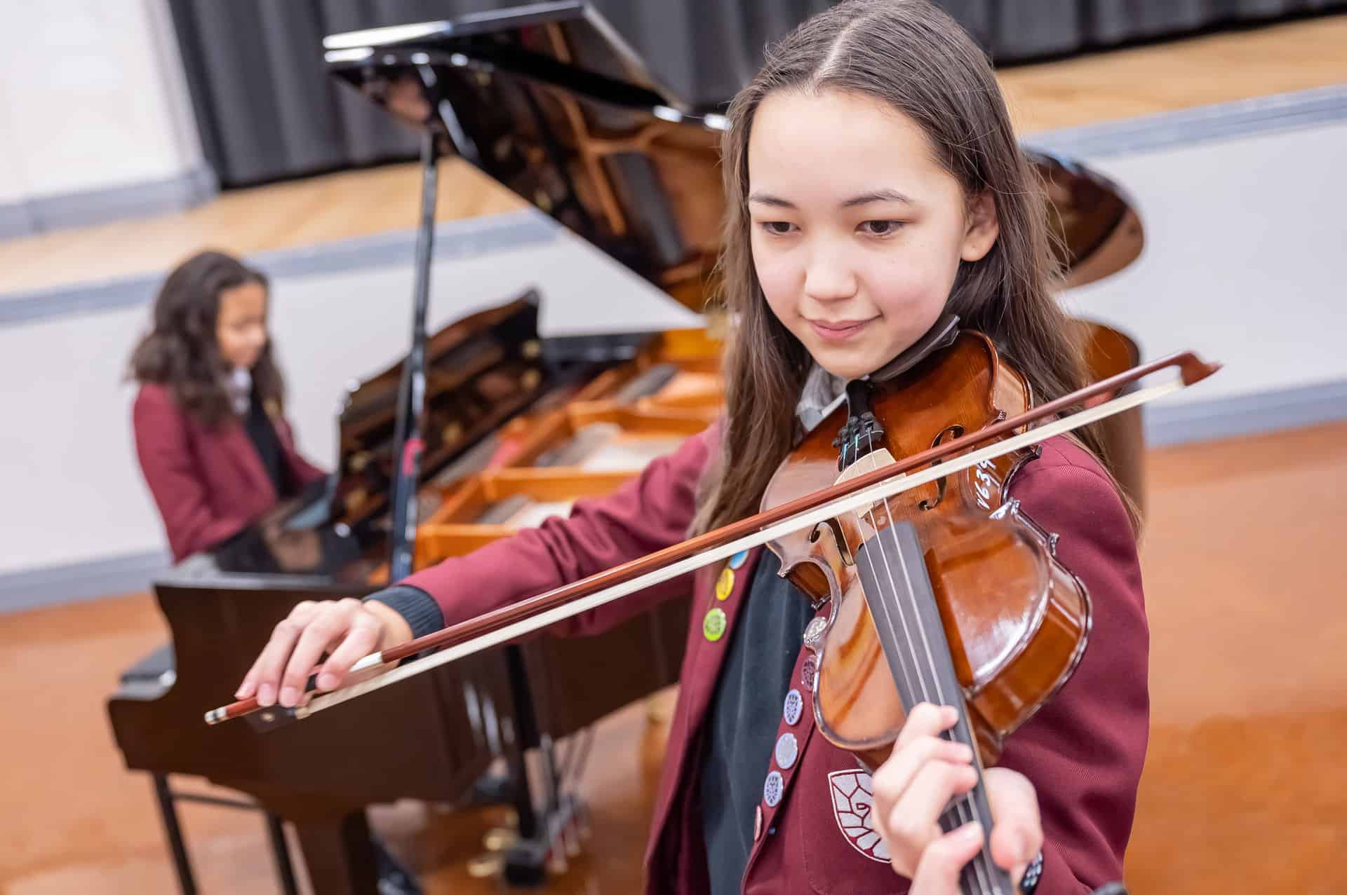 Image of students at a Laurus Trust school playing musical instruments.