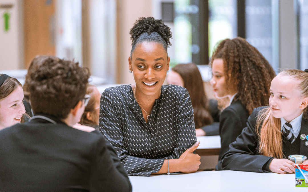 A member of staff speaking with students at one of our Laurus Trust schools.