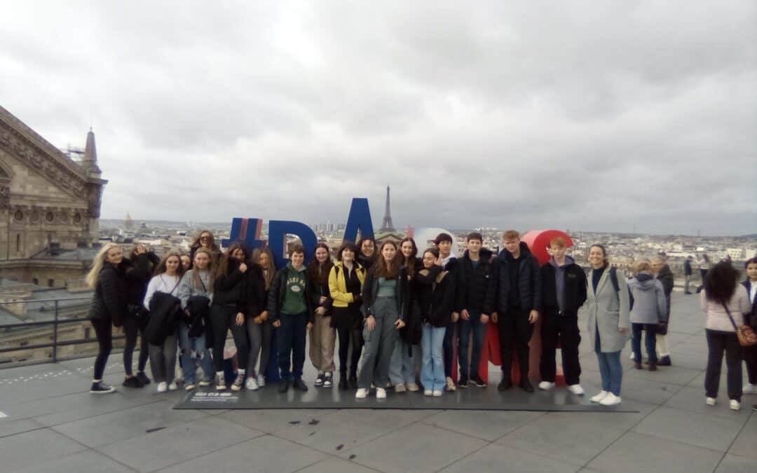 Students from Laurus Trust secondary schools stand on a rooftop in Paris.
