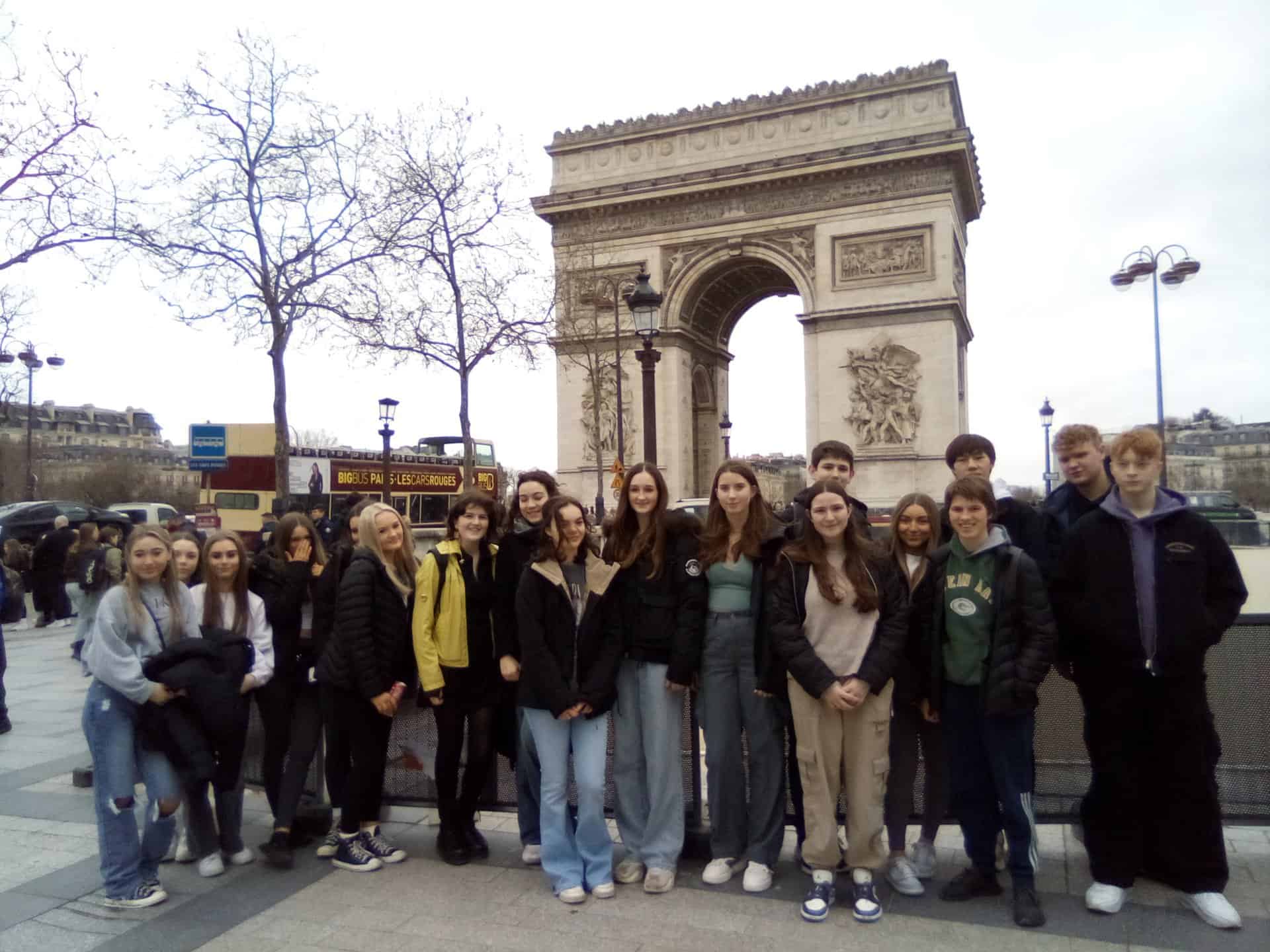 Students from Laurus Trust secondary schools stand in front of the Arc de Triomphe.